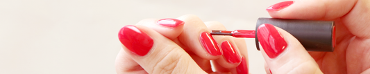 Applying bright red gel nail on finger nails. Using HOMEI Weekly gel.