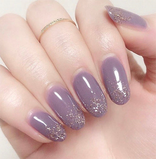 Elegant purple gel nails with gold slarkles, done by Weekly Gel